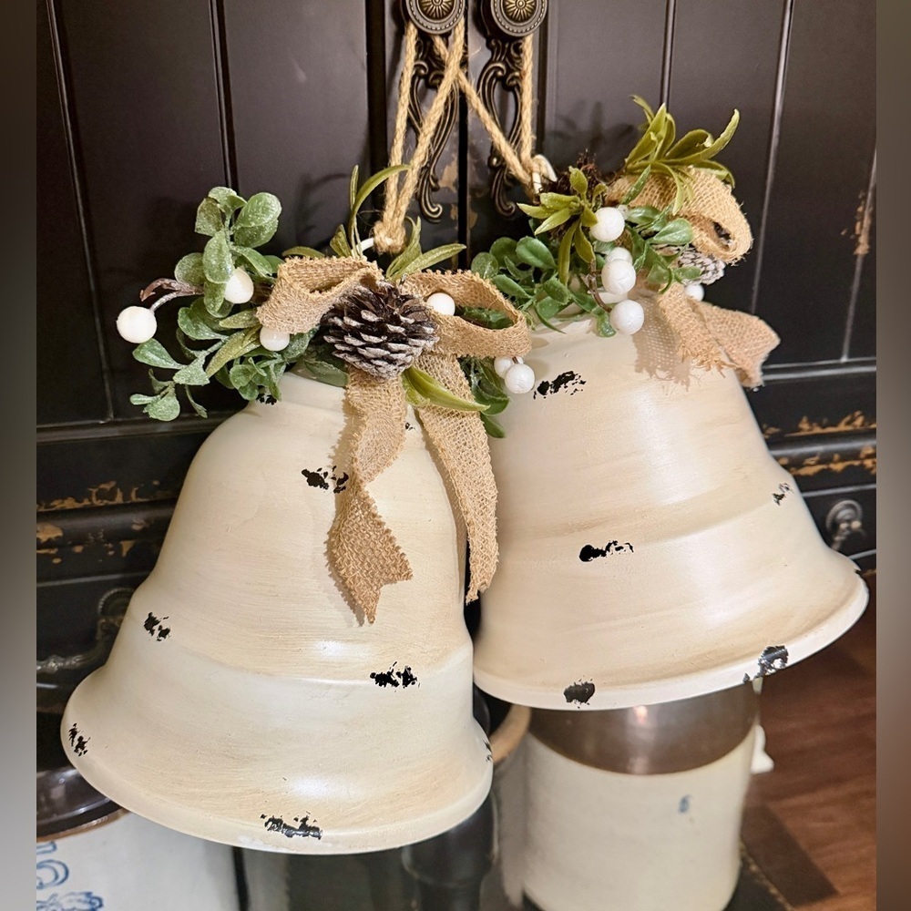 8” METAL HANGING BELLS IN DISTRESSED OFF-WHITE FINISH.